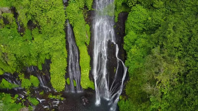 Scenic waterfall in tropical environment, aerial