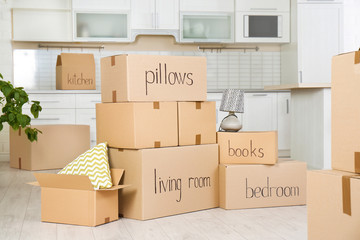 Many cardboard boxes in kitchen. Moving day