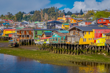 Beautiful coorful houses on stilts palafitos in Castro, Chiloe Island