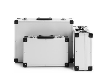 Set of modern suitcases on white background