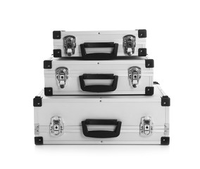 Set of modern suitcases on white background
