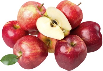 Pile of apples with one apple cut in half in front