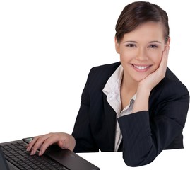 Businesswoman Sitting at a Laptop and Resting on Hand - Isolated