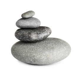 Stack of zen spa stones on white background