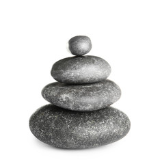 Stack of zen spa stones on white background