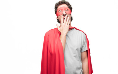 Young bearded super hero Looking unenthusiastic and bored, listening to something dull and tedious,...