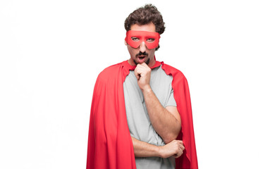 Young bearded super hero with a goofy, dumb, silly look, feeling shocked and confused at a recent...