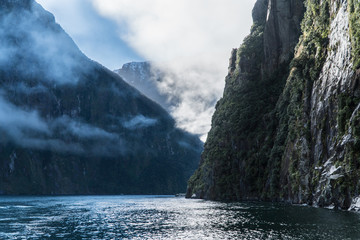 Mountains and clouds in Milford Sound, New Zealand