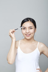 woman with cosmetics brush
