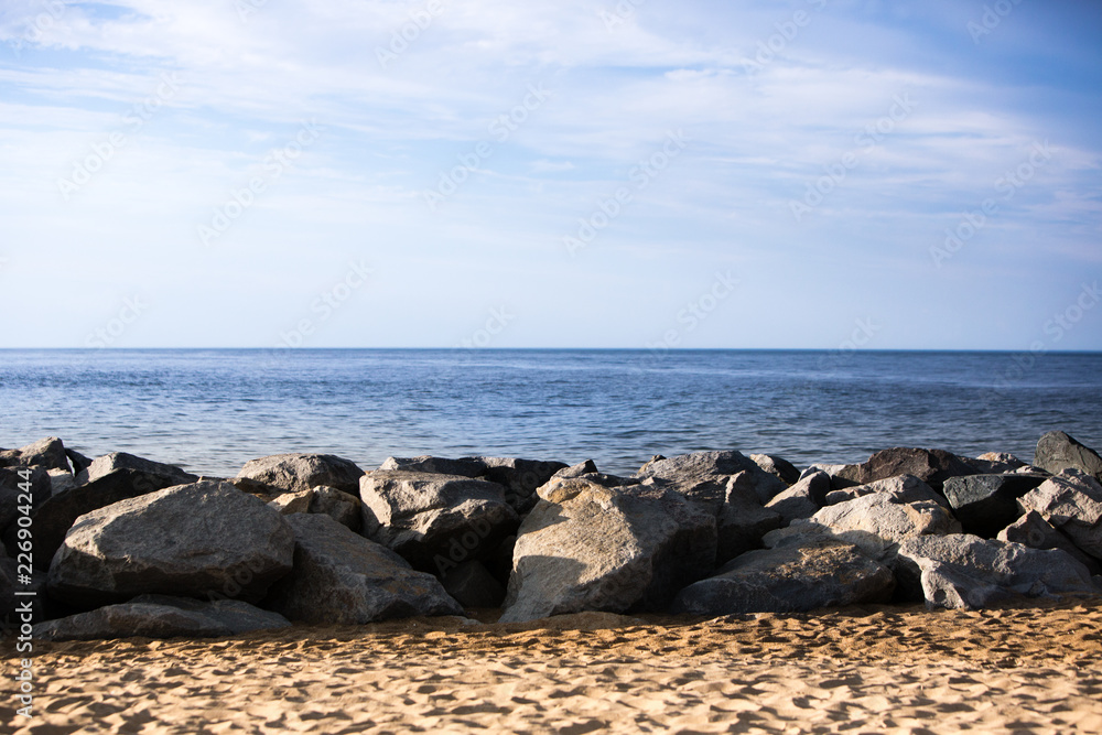 Wall mural beach rock jetty atlantic ocean