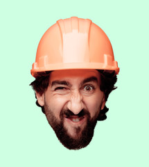 young crazy bearded man cutout head expression isolated. built worker role. angry expression