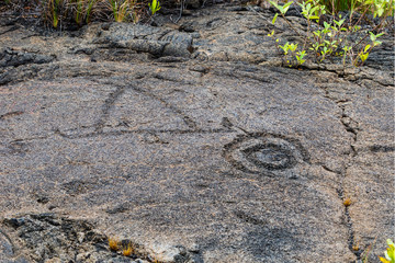 Petroglyphs in lava rock at Pu'uloa along Chain of Craters road, in volcano National Park on the island of Hawaii. Carvings are 400-700 years old.