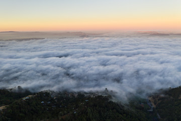 Naklejka na ściany i meble Aerial View of Fog and San Francisco Bay Area at Sunrise