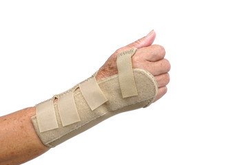 Old female hand wearing hand wrist therapy support glove isolated on white