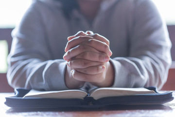 Teenager woman hands praying to god with the bible. Woman Pray for god blessing to wishing have a...