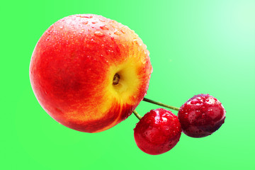 Fruit slimming, peach and cherry isolated on green background with clipping path,