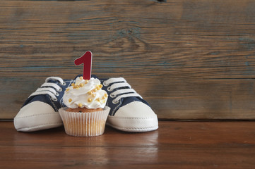 Delicious birthday сupcakes for a baby shower on wooden background