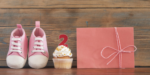 Delicious birthday сupcakes for a baby shower on wooden background