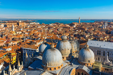 Venice panoramic aerial view with red roofs, Veneto, Italy. Aerial view of the Venice city, Italy. Venice is a popular tourist destination of Europe. Venice, Italy.