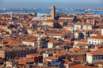 Naklejka premium Venice panoramic aerial view with red roofs, Veneto, Italy. Aerial view with dense medieval red roofs of Venice, Italy