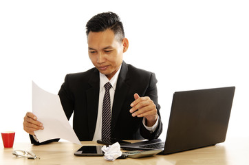 Asian business man reading document and happy on white backgrounds