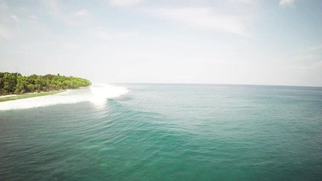 Waves move to Mentawai Island shore, aerial