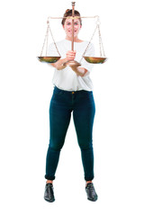 young beautiful girl comparing with a vintage justice scale or balance