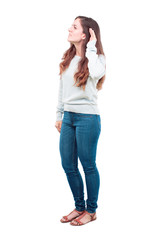 young pretty girl full body paying attention, trying to hear and listen to what is being said,...