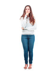young pretty girl full body with a goofy, dumb, silly look, feeling shocked and confused at a...