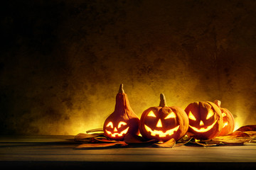 Halloween pumpkins of night spooky on wooden