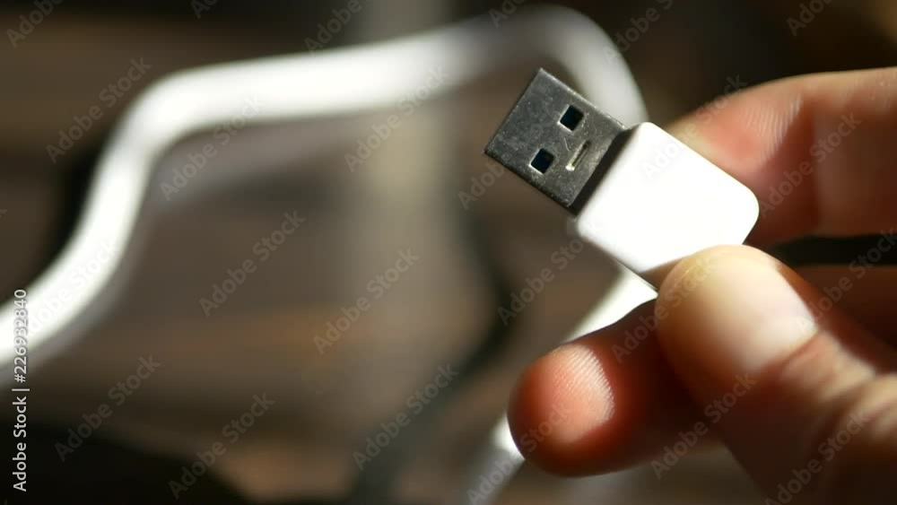 Poster close up macro shot of a standard white usb cable for use with charging a smartphone or data transfe