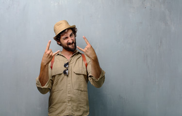 young traveler man singing rock, dancing, shouting, gesturing in a rebellious, angry way.
