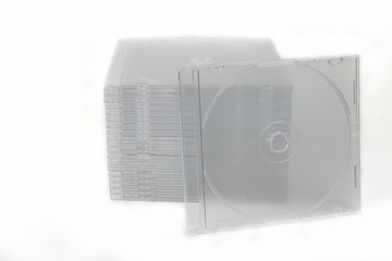 Clear, slim CD or DVD media disc cases stacked neatly