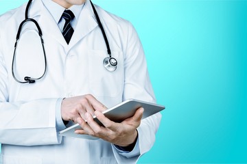 Doctor at hospital working with tablet pc