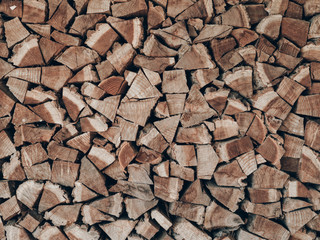 Firewood for the winter, stacks of firewood, pile of firewood.
