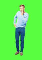 young blonde man looking, observing, keeping an eye on an object in front, or watching out for...