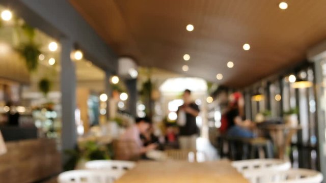 blurred background of people shopping in coffee shop.