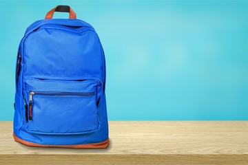 Blue school bag on background