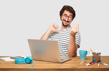 young bearded graphic designer with a laptop looking happy, proud and satisfied, gesturing cash or...