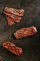 Hot Fresh Gaucho Steak and Flank Steak on Barbecue Grill Background