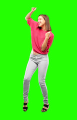 young woman full body. smiling and dancing to fun, lively disco music, looking happy and in a...