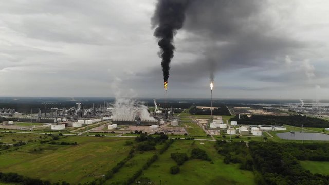 Chemical Plant Conducting Controlled Flaring to Burn Off Excess Materials in Channelview near Houston, Texas Filmed by Drone