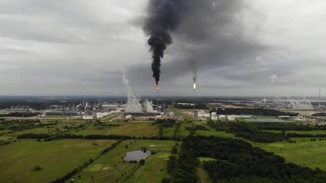 Chemical Plant Conducting Controlled Flaring to Burn Off Excess Materials in Channelview near Houston, Texas Filmed by Drone