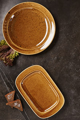 Vintage Dark Blackboard with Natural Empty Ceramic Plates Top View