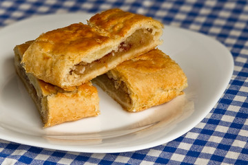 Photo of homemade apple strudel. Detail of traditional dessert.