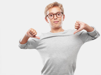 young blonde handsome boy with a proud, happy and confident expression; smiling and sure of success, pointing to one's self with both hands, giving an 