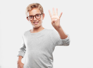 young blonde handsome boy smiling and looking satisfied and happy, counting number four with fingers.