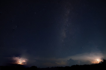 Obraz na płótnie Canvas Milkyway and Lightning Sky at night