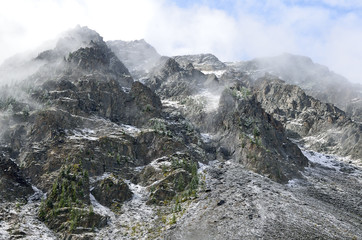 The slopes of the Altai mountains in the fog, district of the Shavlinskoye lake 