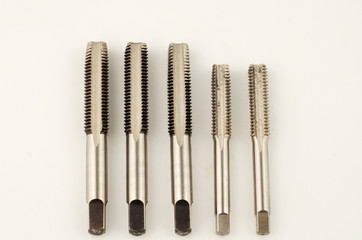 Cutting tool to make thread known as hand tap on white background